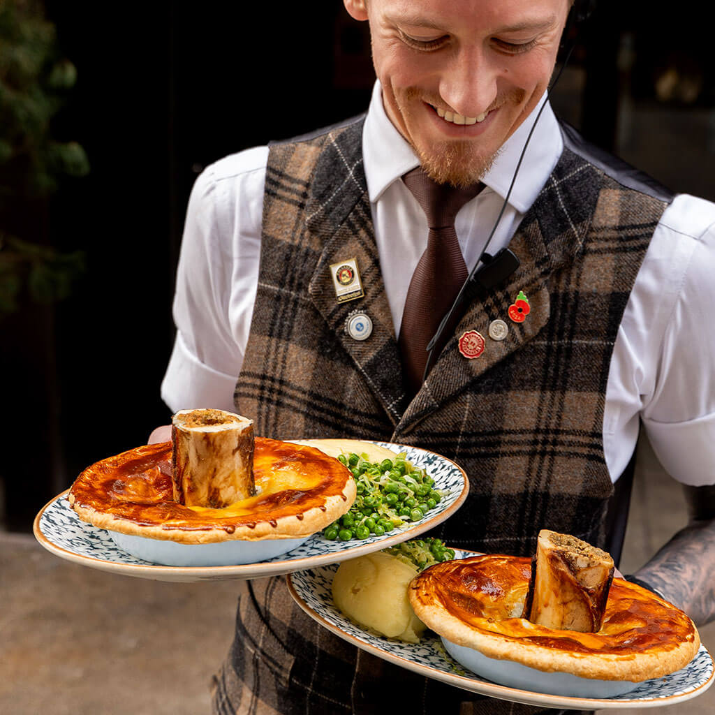 Albert Schloss St Patricks Month Man with two plates of food